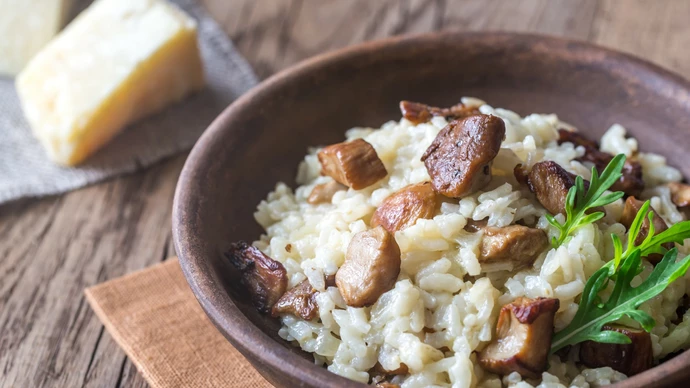 brown dish with a serving of lamb risotto