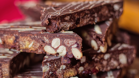 Thick triangles of refrigerated chocolate cake mixed with digestive biscuit and marshmallows