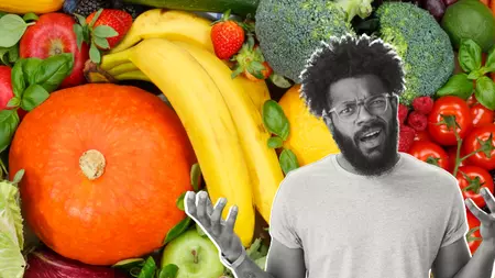 Confused man in front of fruit and veg