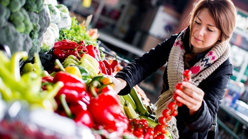 young person shopping in fresh food ailse in supermarket